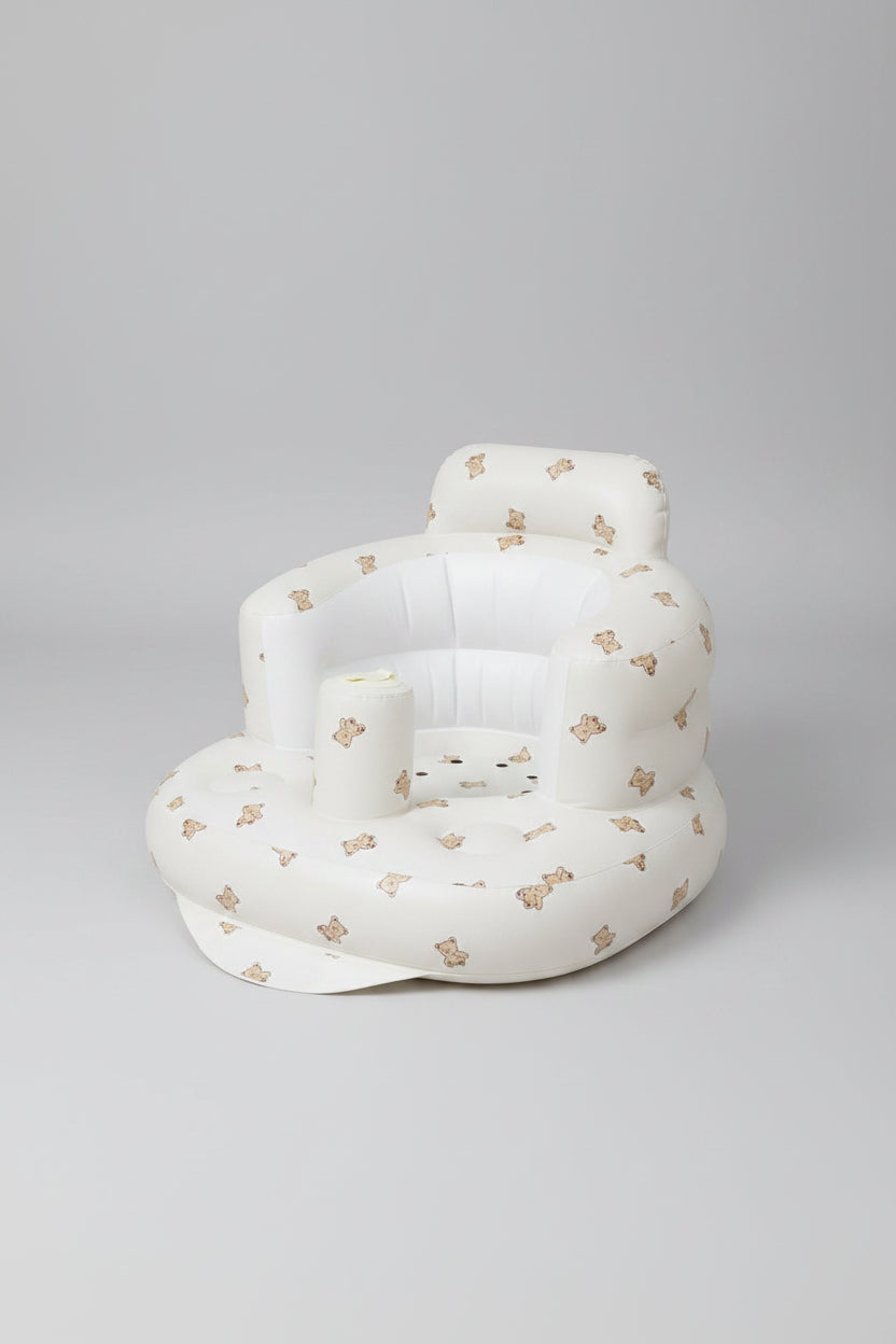 White inflatable chair with teddy bear pattern on a white background