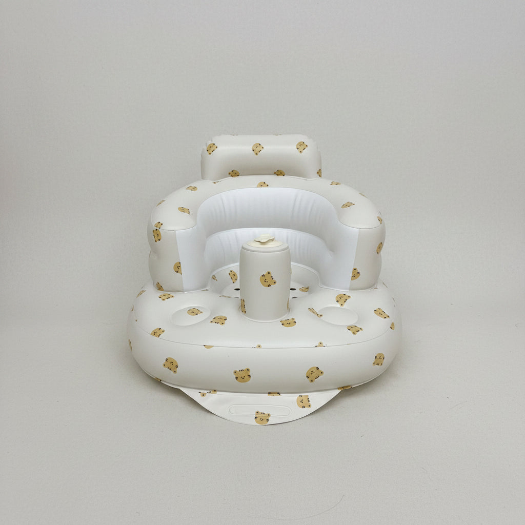 White inflatable baby seat with teddy bear patterns on a white background