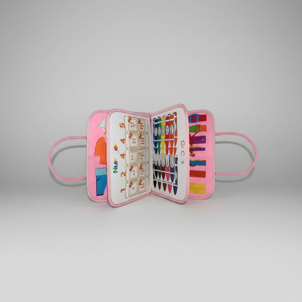 Pink children's art set with crayons and drawing tools on a white background