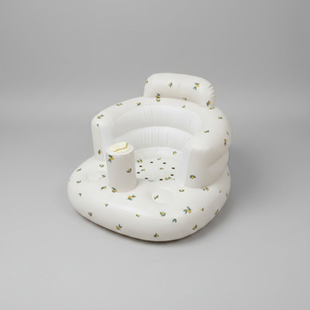 White inflatable chair with small decorative elements on a white background