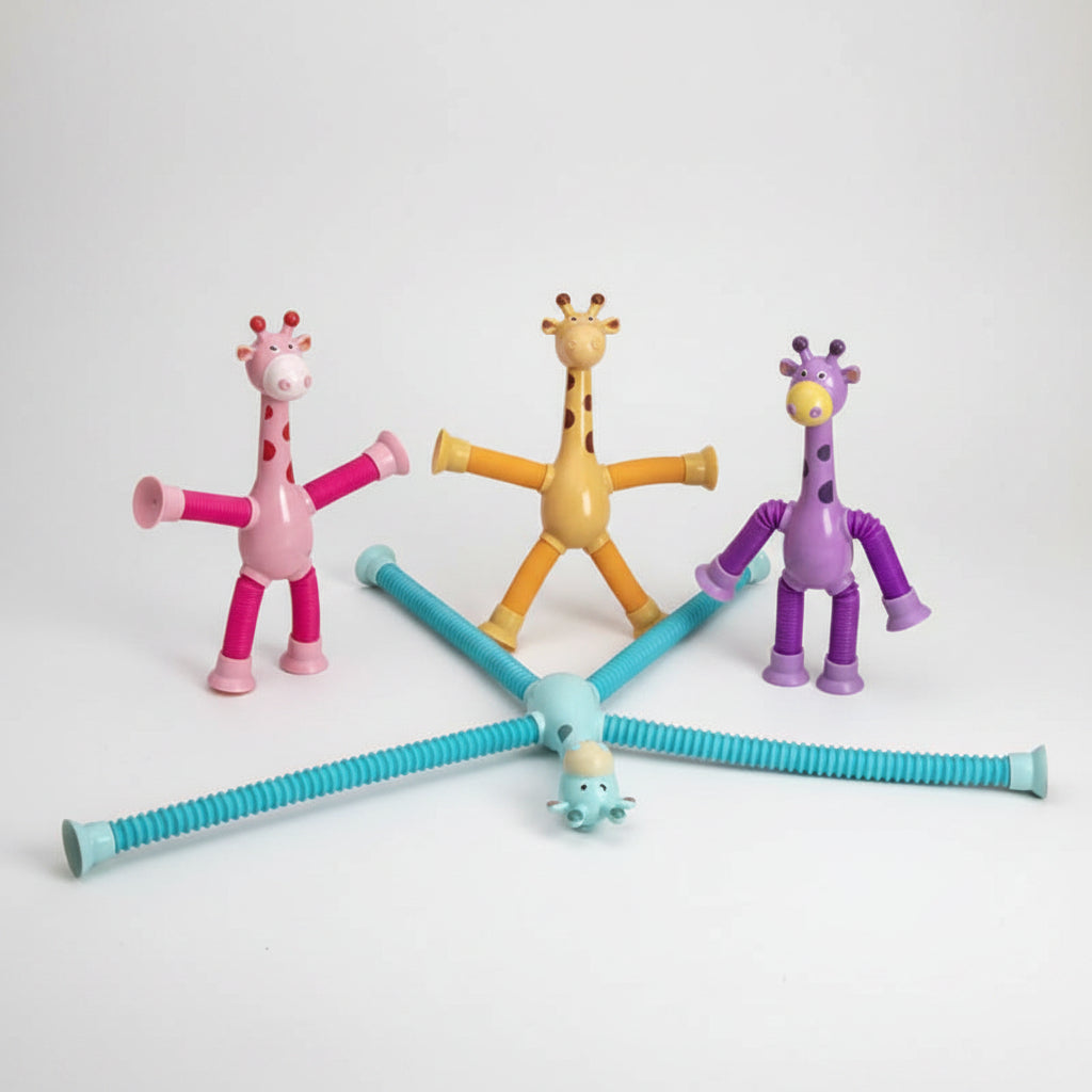 Colorful giraffe toys with flexible necks on a light pink background