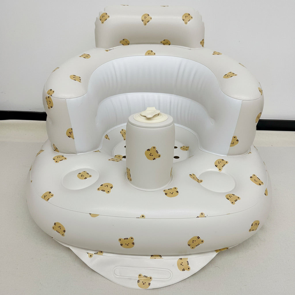 White inflatable baby seat with teddy bear patterns on a white background